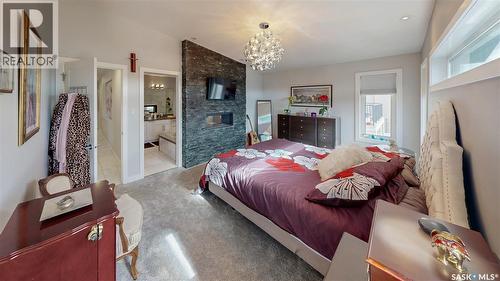 4369 Albulet Drive, Regina, SK - Indoor Photo Showing Bedroom With Fireplace