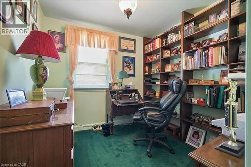 Room featuring extensive built-in shelving, a single window, and wall-to-wall carpeting - 2117 Edinburgh Drive, Burlington, ON - Indoor Photo Showing Office