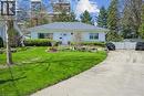White exterior residence with a gray shingled roof and front landscaping - 2117 Edinburgh Drive, Burlington, ON  - Outdoor 
