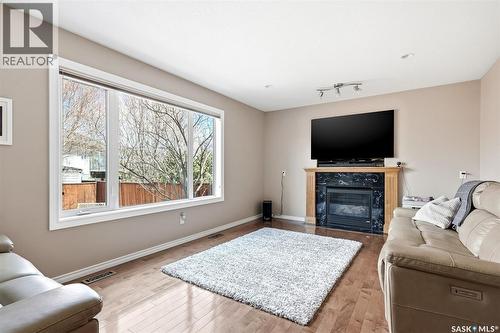 4914 Schwartz Way, Regina, SK - Indoor Photo Showing Living Room With Fireplace