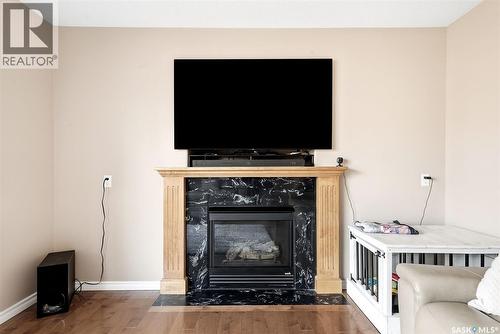4914 Schwartz Way, Regina, SK - Indoor Photo Showing Living Room With Fireplace