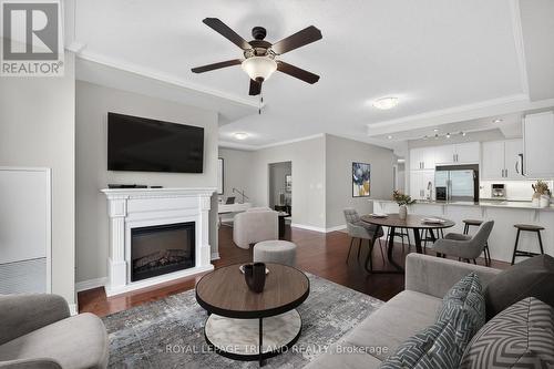 801 - 330 Ridout Street N, London East (East K), ON - Indoor Photo Showing Living Room With Fireplace