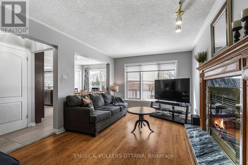 17 Hunterswood Crescent, Ottawa, ON - Indoor Photo Showing Living Room With Fireplace