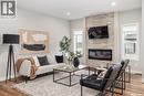450 Leskiw Bend, Saskatoon, SK  - Indoor Photo Showing Living Room With Fireplace 