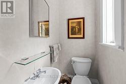 MAIN FLOOR POWDER ROOM - 
