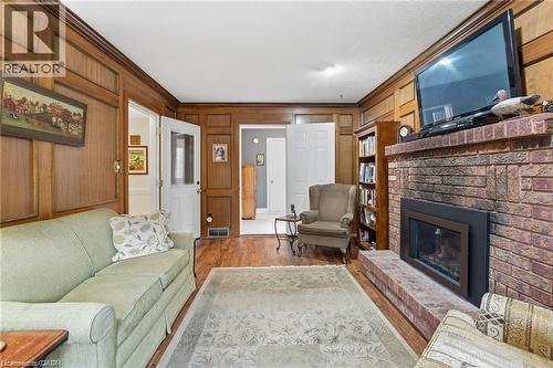 Family room with gas fireplace and entry to mudroom - 668 Tomahawk Crescent, Ancaster, ON - Indoor Photo Showing Living Room With Fireplace