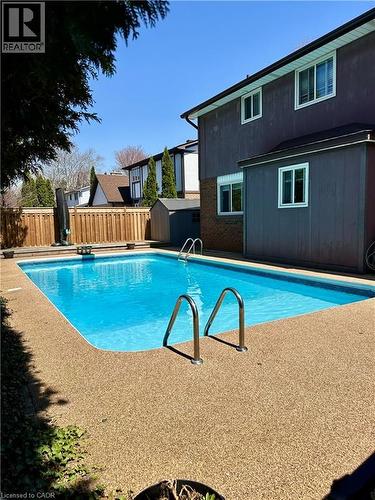 Inground Pool with privacy, grassy area and shed - 668 Tomahawk Crescent, Ancaster, ON - Outdoor With In Ground Pool