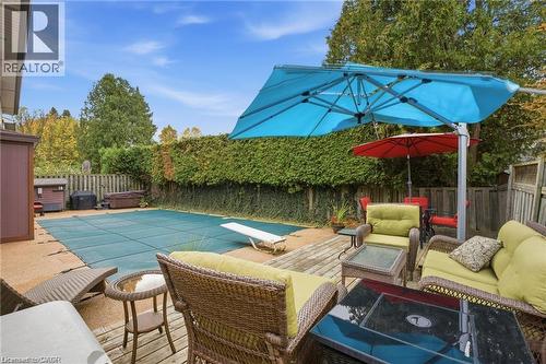 View of Patio Furniture/deck entertaining space - 668 Tomahawk Crescent, Ancaster, ON - Outdoor With In Ground Pool With Deck Patio Veranda With Backyard