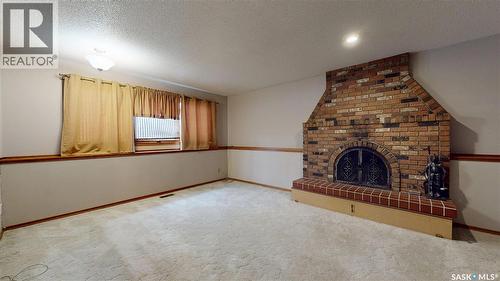 114 Windfield Road, Regina, SK - Indoor With Fireplace