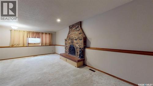 114 Windfield Road, Regina, SK - Indoor Photo Showing Other Room With Fireplace