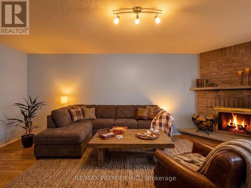 Virtually Staged - 4579 Guildwood Way, Mississauga, ON - Indoor Photo Showing Living Room With Fireplace