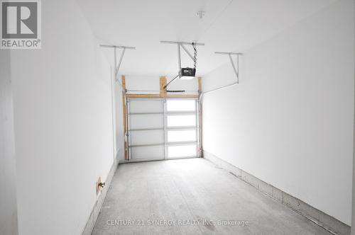 Garage with light panels in garage door - 284 Ormiston Crescent, Ottawa, ON - Indoor Photo Showing Garage