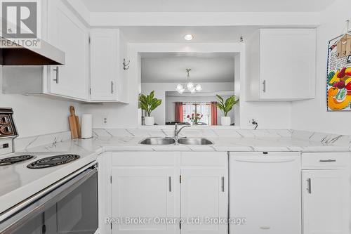 8 - 5982 Dunn Street, Niagara Falls (Arad/Fallsview), ON - Indoor Photo Showing Kitchen With Double Sink