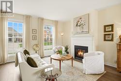 Living w/floor to ceiling windows - 