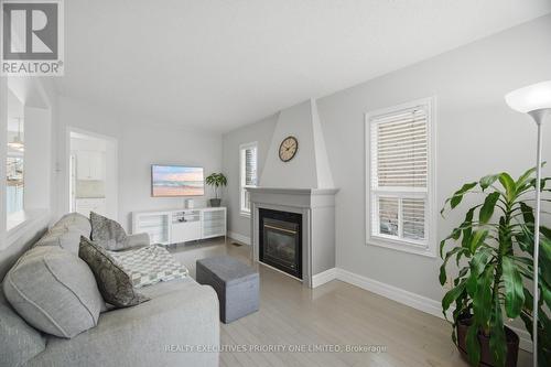 24 Archbury Circle, Caledon, ON - Indoor Photo Showing Living Room With Fireplace