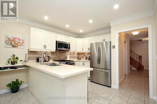 7303 Lantern Fly Hollow, Mississauga, ON - Indoor Photo Showing Kitchen With Stainless Steel Kitchen With Double Sink