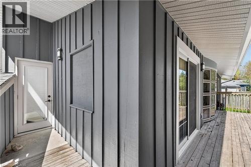 Exterior deck featuring painted vertical siding, a sliding glass door, and a white screen door - 515 Bobbybrook Drive, London, ON - Outdoor With Deck Patio Veranda With Exterior
