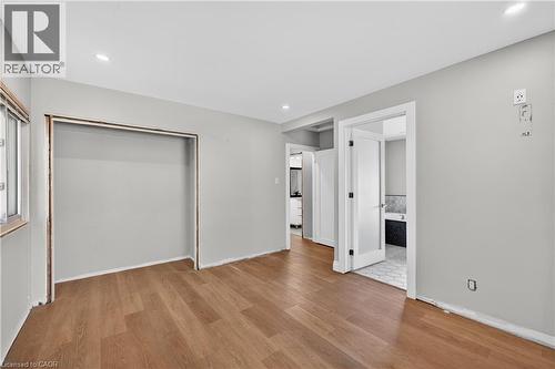 Wood-finish flooring throughout, recessed lighting, and a closet alcove - 515 Bobbybrook Drive, London, ON - Indoor Photo Showing Other Room