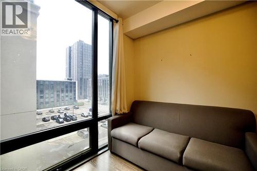 Floor-to-ceiling window framing urban structures - 330 Phillip Street Unit# S605, Waterloo, ON - Indoor