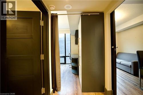 Wood-finish flooring throughout - 330 Phillip Street Unit# S605, Waterloo, ON - Indoor Photo Showing Other Room