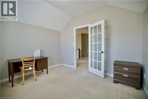 Room featuring a vaulted ceiling, neutral wall tones, and plush carpeting - 711 Cedar Bend Drive, Waterloo, ON - Indoor