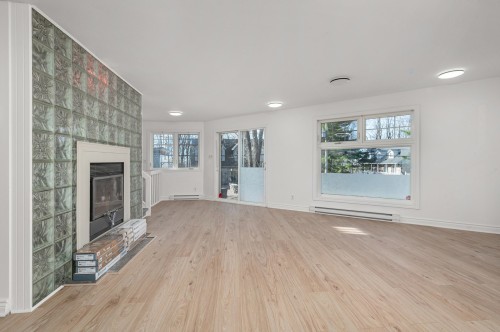 Living Room - 1011 Rue Lapointe, Terrebonne (Lachenaie), QC - Indoor With Fireplace