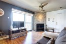 Salon - 302-64 Rue Pierre-Laporte, Saint-Eustache, QC  - Indoor Photo Showing Living Room With Fireplace 