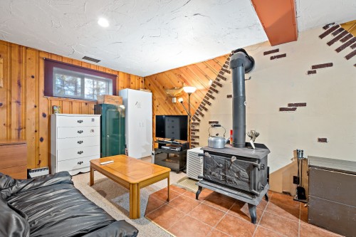 Salle familiale - 789 Place Kavanagh, Mont-Tremblant, QC - Indoor With Fireplace