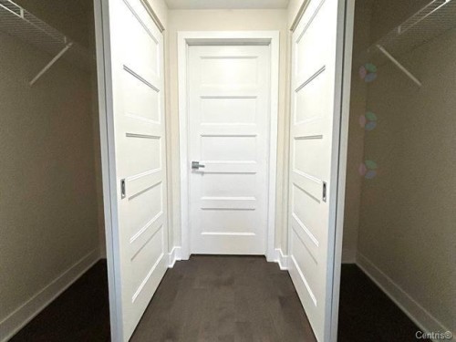 Closet - 711-2160 Av. Terry-Fox, Laval (Chomedey), QC - Indoor Photo Showing Other Room