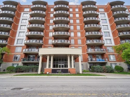 Front of Structure - 711-2160 Av. Terry-Fox, Laval (Chomedey), QC - Outdoor With Balcony With Facade