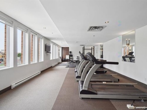 Exercise Room - 711-2160 Av. Terry-Fox, Laval (Chomedey), QC - Indoor Photo Showing Gym Room