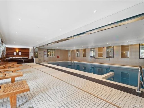 Pool - 711-2160 Av. Terry-Fox, Laval (Chomedey), QC - Indoor Photo Showing Other Room With In Ground Pool