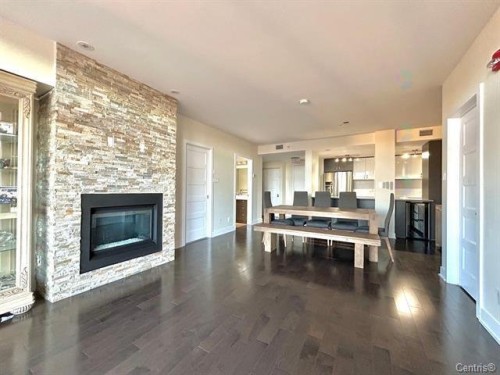 Overall view - 711-2160 Av. Terry-Fox, Laval (Chomedey), QC - Indoor Photo Showing Other Room With Fireplace