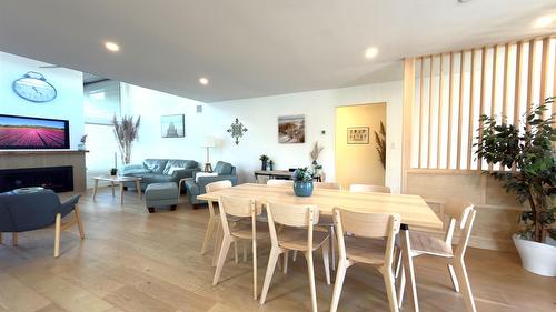 338 Burne Avenue, Kelowna, BC - Indoor Photo Showing Dining Room With Fireplace