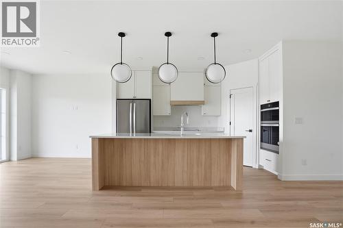 20 720 Brighton Boulevard, Saskatoon, SK - Indoor Photo Showing Kitchen With Upgraded Kitchen
