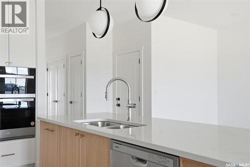 20 720 Brighton Boulevard, Saskatoon, SK - Indoor Photo Showing Kitchen With Double Sink