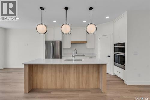 20 720 Brighton Boulevard, Saskatoon, SK - Indoor Photo Showing Kitchen With Upgraded Kitchen