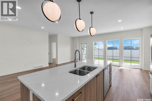 20 720 Brighton Boulevard, Saskatoon, SK - Indoor Photo Showing Kitchen With Double Sink