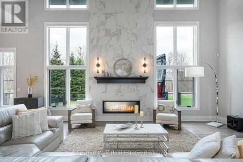 Great room with 2 sided fireplace - 1 Windrose Valley Boulevard, Clearview, ON - Indoor Photo Showing Living Room With Fireplace