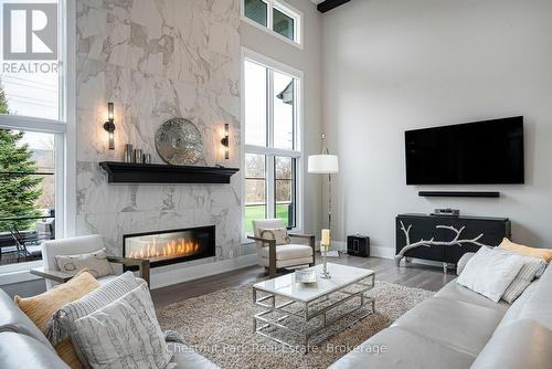 Open floor plan living - 1 Windrose Valley Boulevard, Clearview, ON - Indoor Photo Showing Living Room With Fireplace
