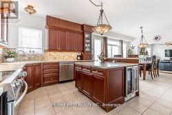 B/I BEVERAGE FRIDGE & RAISED BKFST BAR. - 