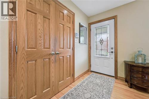 Entryway featuring hardwood flooring, light-toned walls, and a white entry door with decorative glass - 574 Sprucehill Avenue, Waterloo, ON - Indoor Photo Showing Other Room