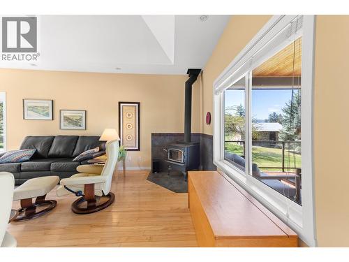 3990 June Springs Road, Kelowna, BC - Indoor Photo Showing Living Room With Fireplace