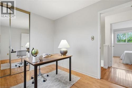 Room featuring wood-finish flooring, and mirrored sliding closet doors - 56 Angela Crescent, Cambridge, ON - Indoor Photo Showing Office