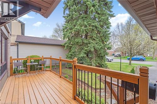 Spacious wood-finish deck with black metal balusters and wood railings - 56 Angela Crescent, Cambridge, ON - Outdoor With Deck Patio Veranda With Exterior