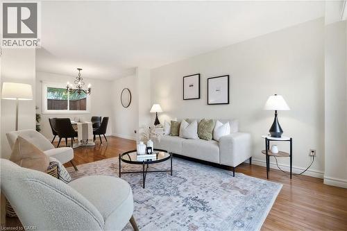 Bright living area featuring wood-finish flooring and neutral wall tones - 56 Angela Crescent, Cambridge, ON - Indoor Photo Showing Living Room