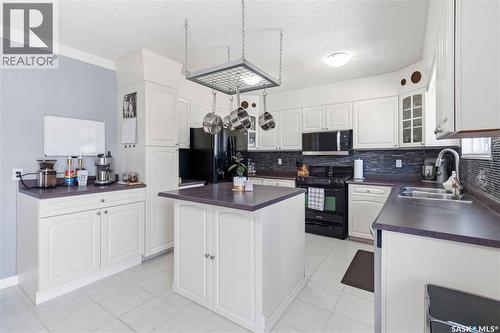 363 Candle Crescent, Saskatoon, SK - Indoor Photo Showing Kitchen With Double Sink