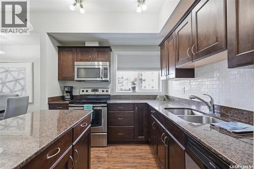 101 110 Hampton Circle, Saskatoon, SK - Indoor Photo Showing Kitchen With Stainless Steel Kitchen With Double Sink With Upgraded Kitchen