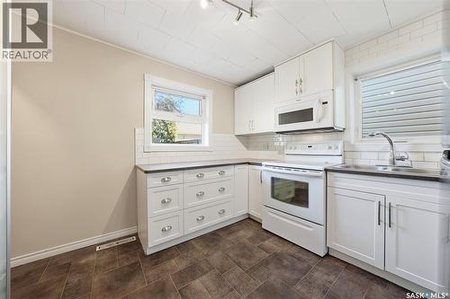 1336 H Avenue N, Saskatoon, SK - Indoor Photo Showing Kitchen With Double Sink