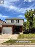 Two-story residence featuring a brick facade on the lower level and horizontal siding on the upper level - 206 Northmanor Crescent, Kitchener, ON 